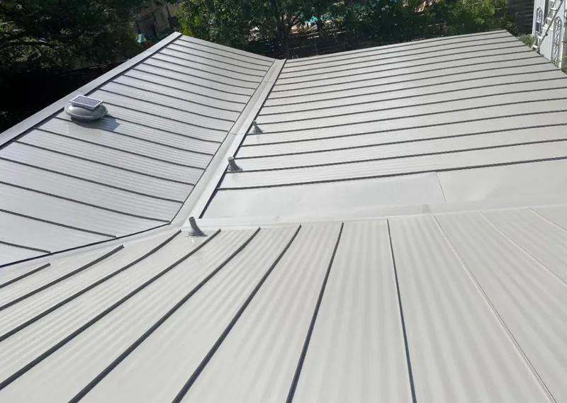 Solar attic fan installed on a metal roof for Roof Ventilation in Deltona